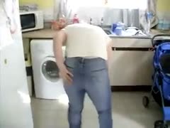 In front of her husband, the wife dons her hawt and tight pants.